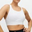 vit Röhnisch Firm High Support Sportsbra (dam) på en modell